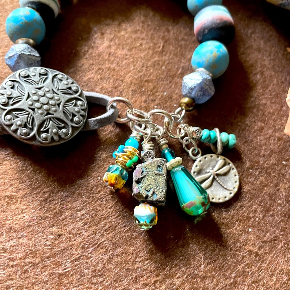 OOAK handmade beaded bracelet with charms , intricate button/leather closure.